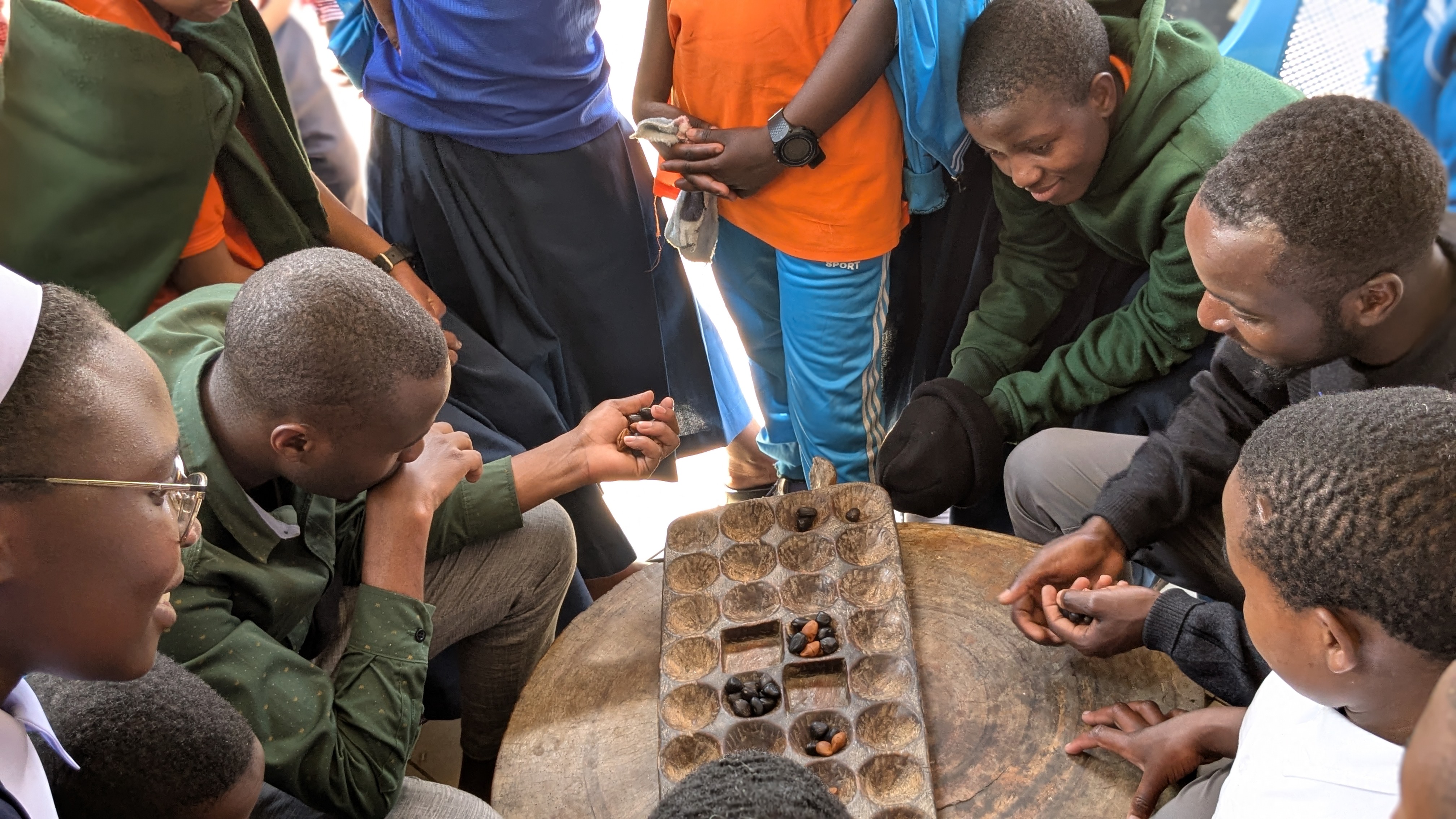 Teachers and students playing BAO